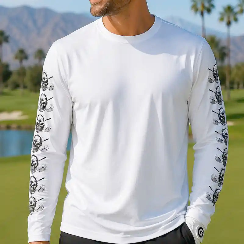 White long-sleeve shirt with black graphic designs on sleeves against a scenic background